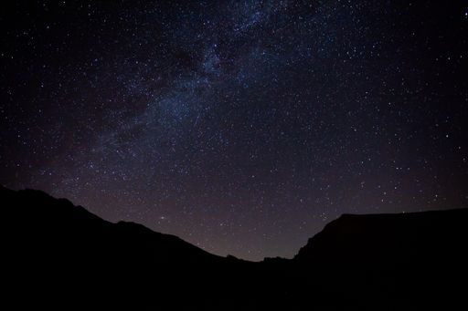 A stunning shot of a silhouette of mountains with milky way in Sierra Nevada, Spain.