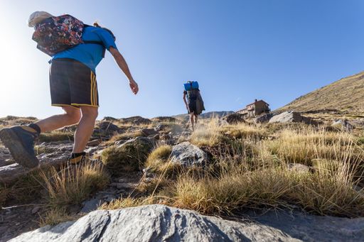 A hiker in Mulhacen in the Sierra Nevada, Spain seen from behind
