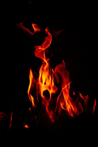A stunning shot of a vibrantly burning fire with a black background