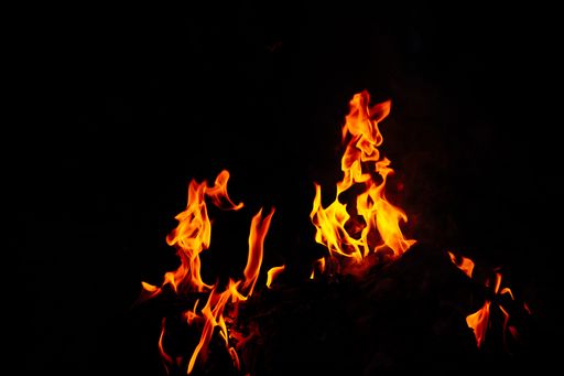 A stunning shot of a vibrantly burning fire with a black background
