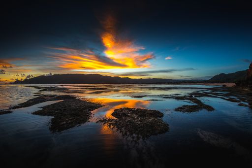 A magnificent view of the reflection of the hills and the sky in the lake in Lombok, Indonesia