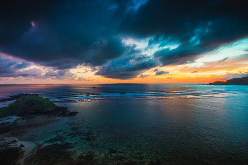 A magnificent view of the peaceful ocean at sunset captured in Lombok, Indonesia