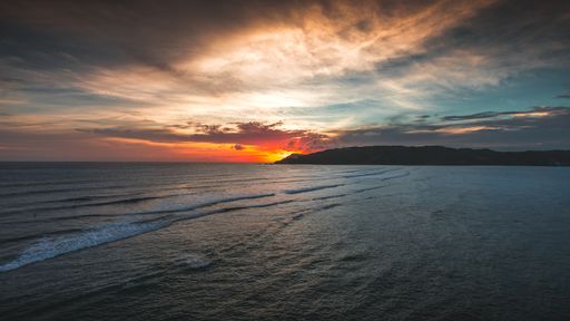 A magnificent view of the peaceful ocean at sunset captured in Lombok, Indonesia