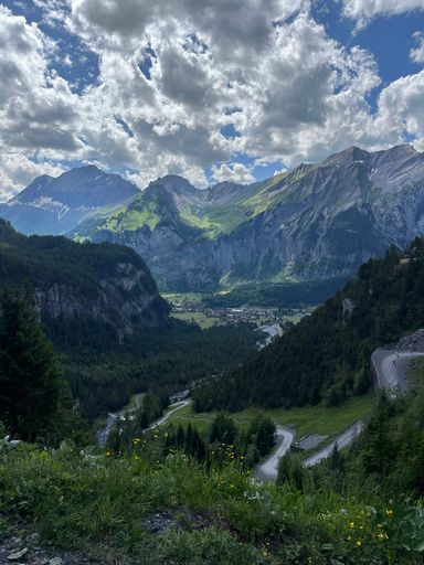 A vertical shot of mountains covered in greenery