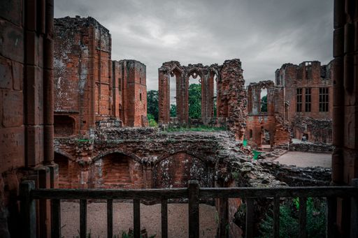 The old destroyed Kenilworth Castle in England on a gloomy day under the cloudy sky