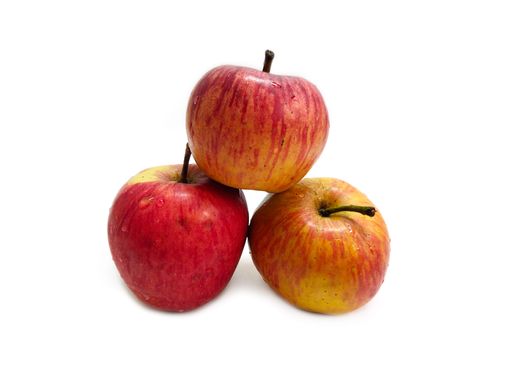 The close-up view of three red apples isolated over a white surface
