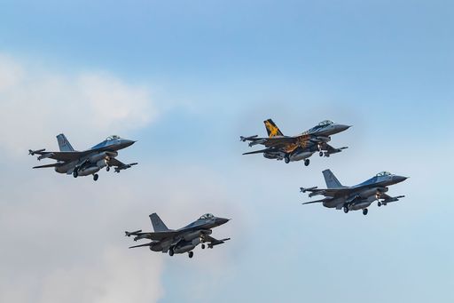 A group of 4 F16s of Belgian Air Force planes in flight during the Sanicole International Airshow