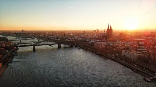 A sunset over Cologne Germany with the Cologne cathedral in the background