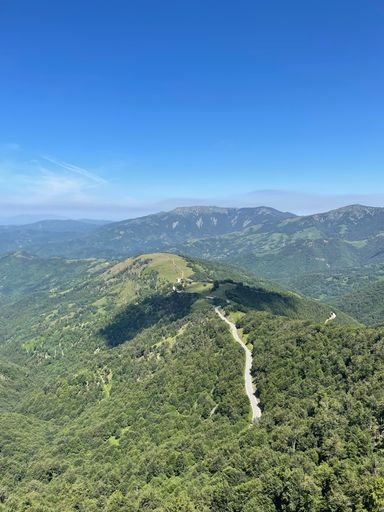 an aerial view of mountains on a beautiful day