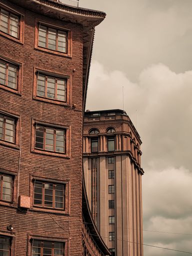 A vertical shot of an ancient building on a cloudy day