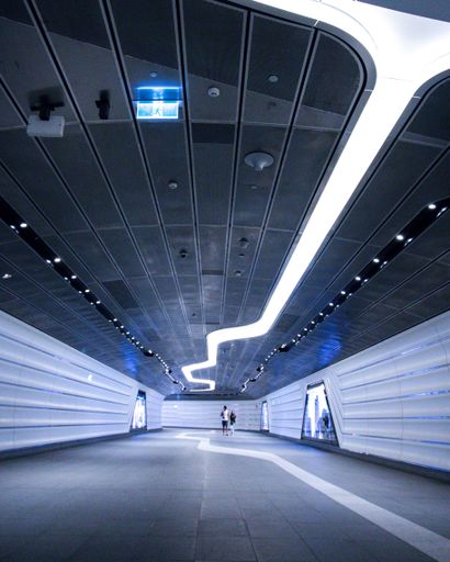 The modern futuristic design of an underground tunnel in an urban city