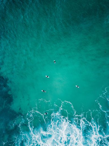 Beautiful aerial shot of ocean waves right from above in bird's eye view - perfect backgrounds and wallpapers