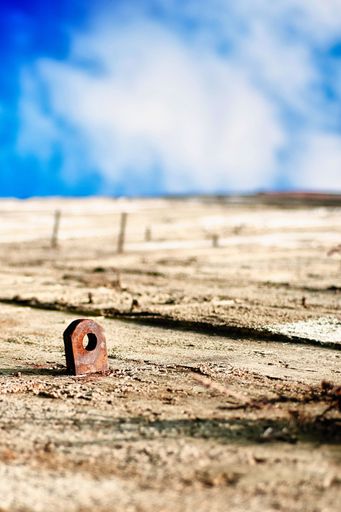 An abstract concrete wall giving the impression of a desert and a blue sky in the background