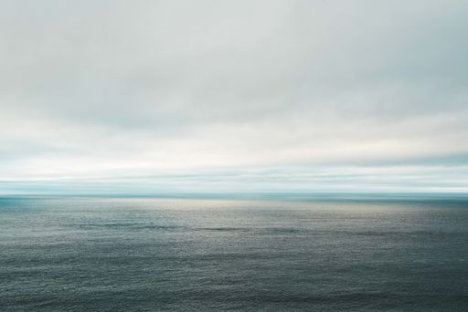 A beautiful shot of the calm Aegean sea in the evening and the cloudy sky in the background