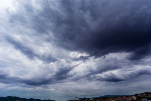 A dark cloudy sky in the evening