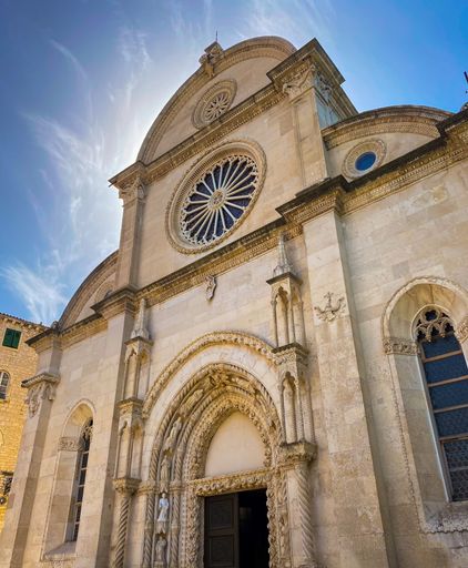 A low-angle shot of the dome of the Cathedral of St. James in Sibenik, Croatia under sunlight