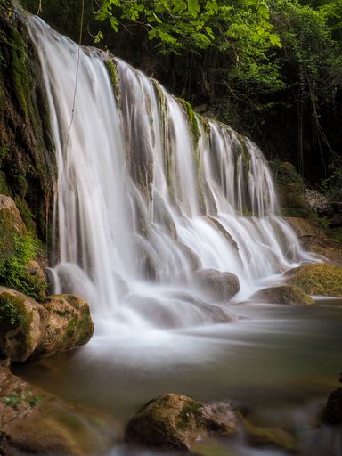 A vertical shot of fairy Mototaki Falls waterfall in Nikaho City