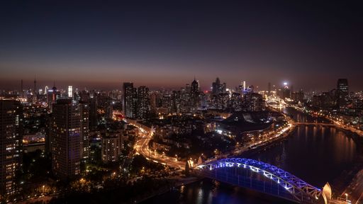 Landmark along the Haihe River in Tianjin, China, including creative blocks and shopping centers, as well as various bridges including Guotai Bridge.