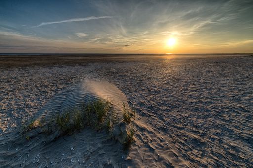 A breathtaking early morning scenery of the sun rising over the ocean