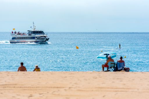 Lloret de Mar, Spain : 2020 2 Sept : Boat in the beach of Lloret de Mar after Covid 19 without international tourists in summer 2020