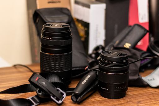 A closeup picture of digital camera lenses on a wooden table in the United States in Bolingbrook