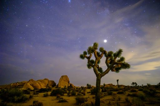 Summertime night long exposure with the milky way just starting to emerge as the clouds and light coming from the west paint the sky