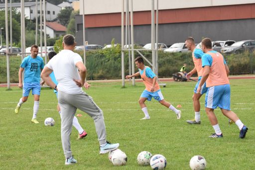 A group of football players playing on a field