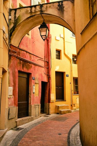 A vertical shot of the narrow alley and buildings captured in Menton, French Riviera, France