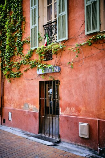 A vertical shot of a beautiful buildings on the pavement captured in Menton, French Riviera, France