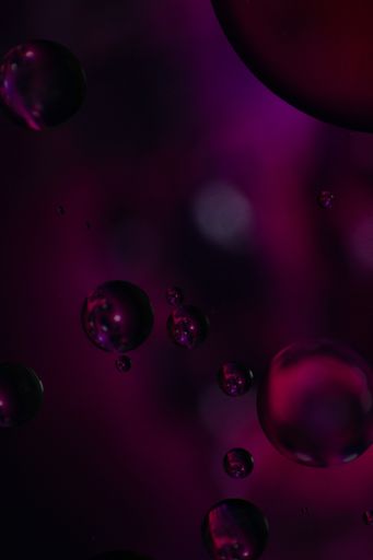 A macro shot of colorful bubbles on a dark background - perfect for wallpapers or background