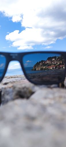 A vertical shot of the coastal village in Macedonia seen through sunglasses