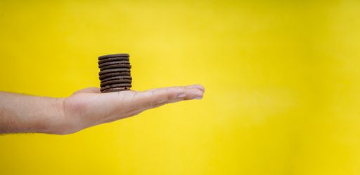 A person holding the sweet chocolate cookies