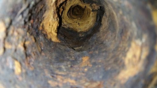 A closeup shot of the inside of an old sewer pipe