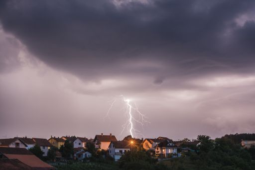 An amazing shot of a village on a stormy sky background