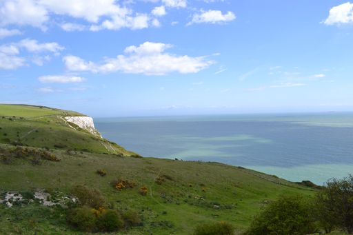A high angle shot of a beautiful landscape near the sea under the cloudy sky in Dover, England