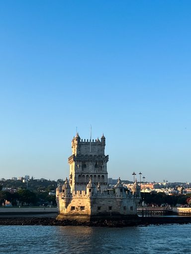 A vertical shot of Belem Tower in Portugal during sunset