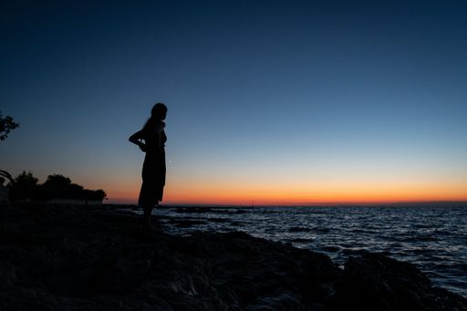 Girl in the sunset on the seaside