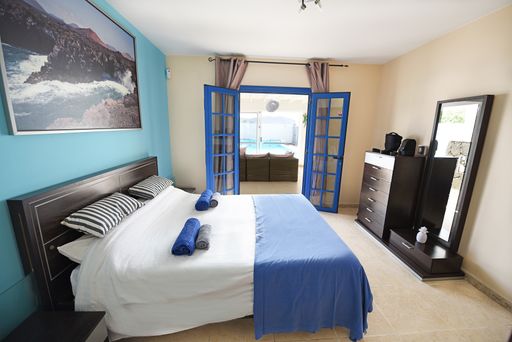 A cozy bedroom in the hotel room during the daytime
