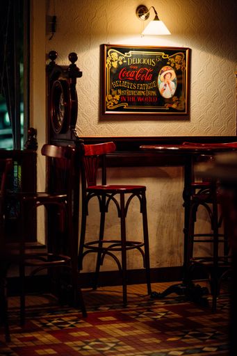 A vertical shot of the retro interior of a pub in Milan, Italy