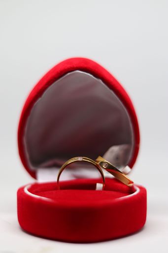 An engagement ring in a red heart-shaped box