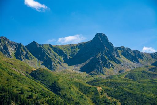 A beautiful shot of the Fagaras Mountains in Romania on a bright day