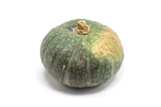 A closeup shot of a green gourd isolated on a white background
