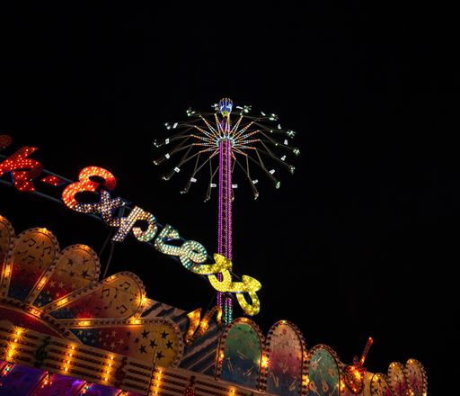 A close up shot from Munich Oktoberfest with carousel and lightshow by night, Munich, Germany