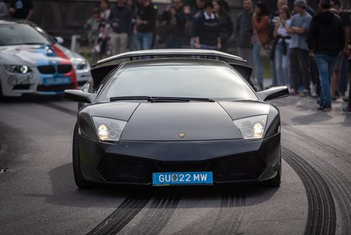 a lamborghini on street with marks