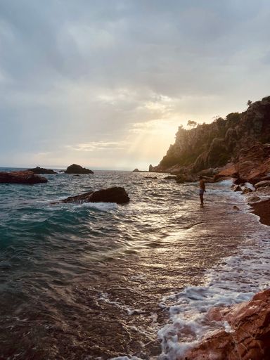 A vertical shot of a beautiful beach in Montenegro at sunset