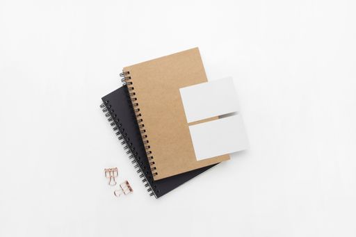 A top view of notebook and stationery products isolated on a white background