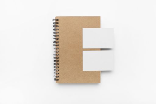 A top view of notebook and stationery products isolated on a white background