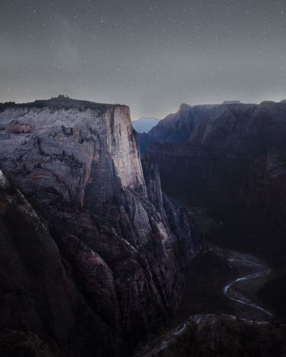 Beautiful rocky mountains and hills with amazing breathtaking starry sky at night