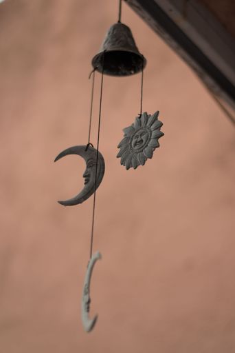 A vertical shot of a beautiful bell hanging from the roof