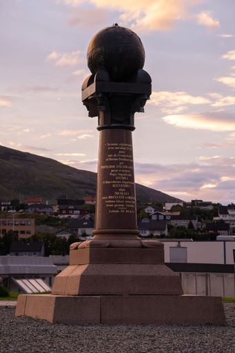 Hammerfest, Norway - July 26, 2022: Beautiful scenery of Hammerfest town and The Struve Geodetic Arc Norway on the Kvaloya Island during sunset